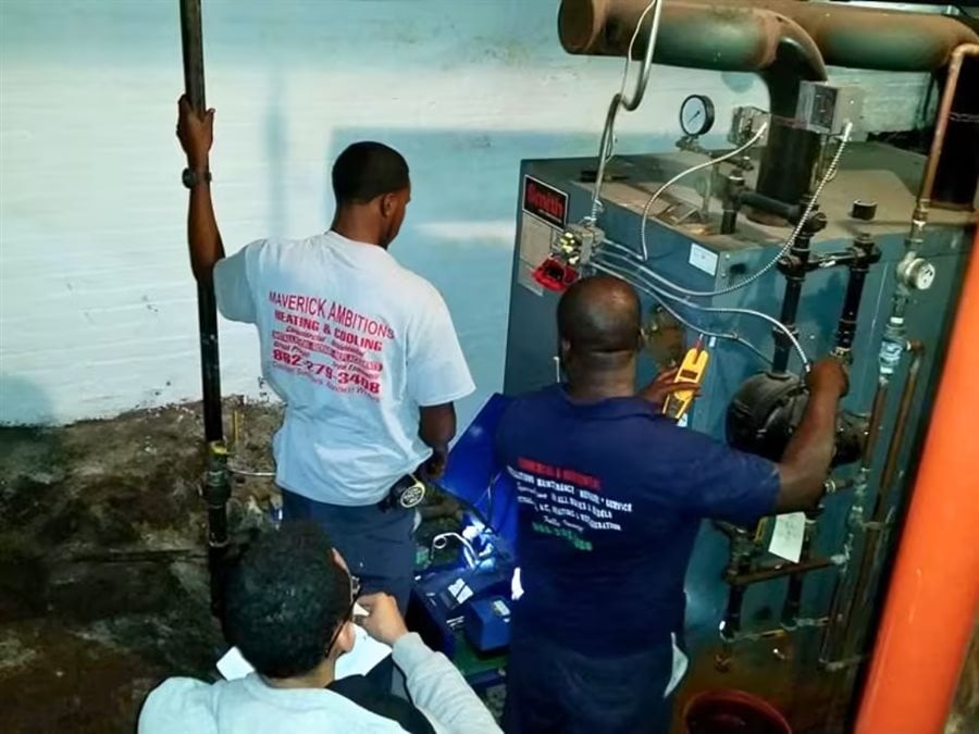 Maverick Ambitions HVAC technicians servicing a boiler