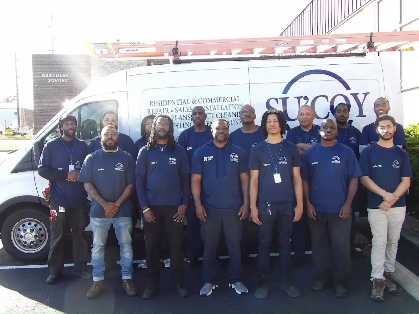 Su'Coy Heating, AC and Duct Cleaning team in front of company van