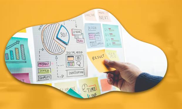 Blog banner: a hand adding a sticky note to a wall of strategy notes.