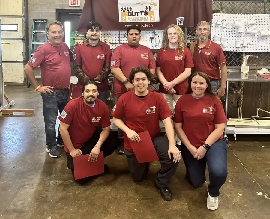 A home-services trade crew standing together in their workshop