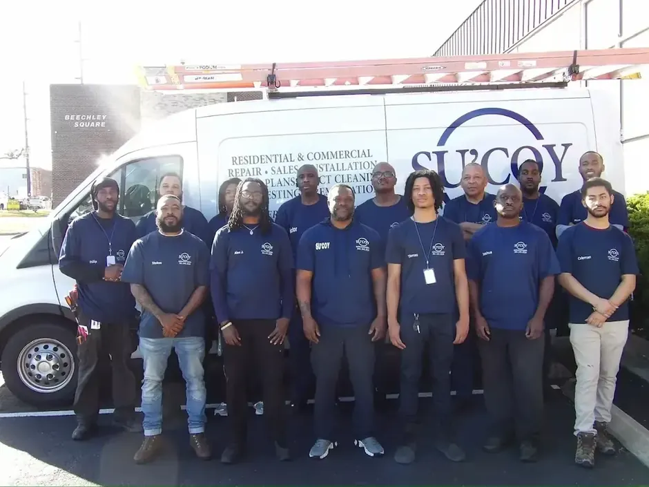 Su&rsquo;Coy Heating, AC and Duct Cleaning team in front of company van