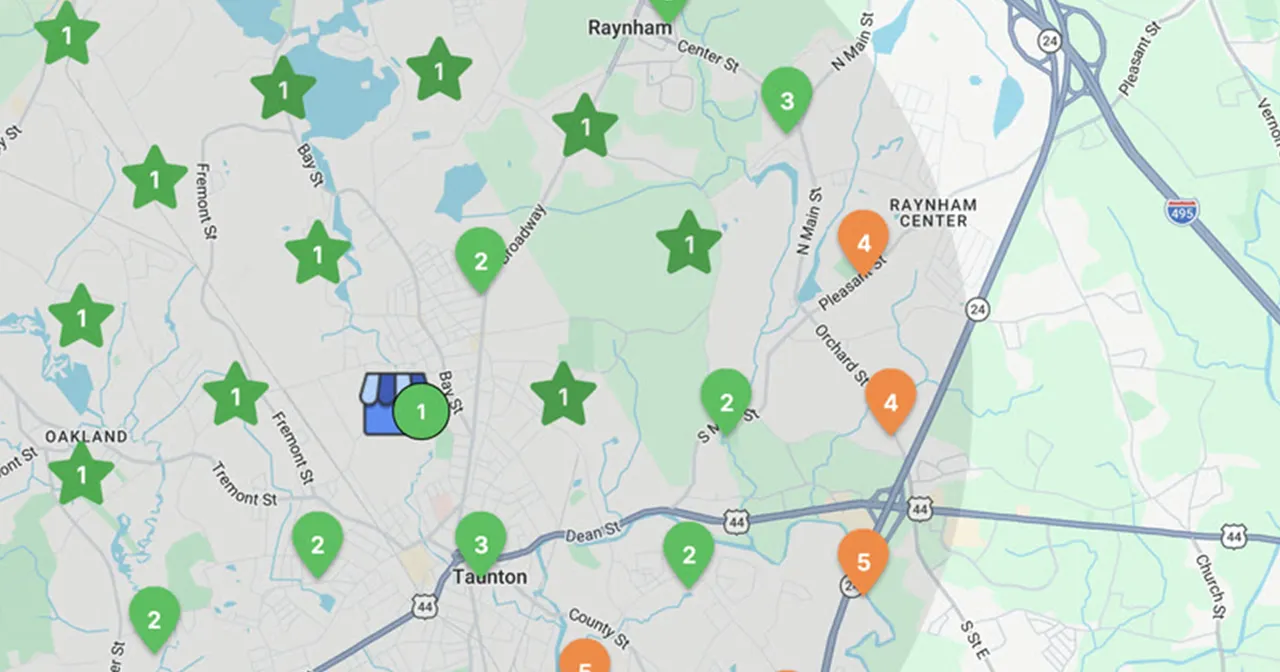 A real local rank-grid scan over a street map, with green pins where the business ranks in the top three and orange pins where it ranks fourth or lower
